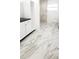 Modern bathroom with a white vanity, stylish tile floors, and a luxurious marble shower at 3372 Elkcam Blvd, Port Charlotte, FL 33952