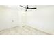 Bedroom with ceiling fan, marble floors, closet and two doors at 3372 Elkcam Blvd, Port Charlotte, FL 33952