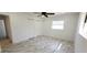 A bright bedroom featuring marble floors, recessed lighting, ceiling fan and closet at 3372 Elkcam Blvd, Port Charlotte, FL 33952