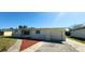 Attractive single-story home with a well-kept lawn, driveway, and an attached one-car garage at 3372 Elkcam Blvd, Port Charlotte, FL 33952