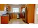 A kitchen with stainless steel appliances, wooden cabinetry, and granite countertops at 3372 Elkcam Blvd, Port Charlotte, FL 33952