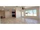 Bright living room featuring marble floors, recessed lighting, and a ceiling fan at 3372 Elkcam Blvd, Port Charlotte, FL 33952