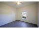 Bright bedroom features a ceiling fan and a window with an outdoor view at 359 Paramaribo St, Punta Gorda, FL 33983