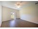 Bedroom featuring a ceiling fan, ample space, large windows, and neutral color palette at 359 Paramaribo St, Punta Gorda, FL 33983