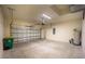 Spacious garage with overhead door, water heater, and trash receptacle at 359 Paramaribo St, Punta Gorda, FL 33983