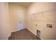 Laundry room with gray floors, overhead rack and washer, dryer hookups at 359 Paramaribo St, Punta Gorda, FL 33983