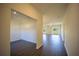 Bright, open-concept living room with modern wood-look floors and sliding glass doors to outdoor space at 359 Paramaribo St, Punta Gorda, FL 33983