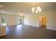 Open concept living room with kitchen view, featuring hardwood floors and recessed lighting at 359 Paramaribo St, Punta Gorda, FL 33983