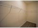 A walk-in closet featuring light colored walls, gray wood floors and wired shelves for organizing clothing at 359 Paramaribo St, Punta Gorda, FL 33983