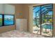 Bedroom featuring a view of the screened lanai, pool and waterfront beyond the sliding glass doors at 3606 Whippoorwill Blvd, Punta Gorda, FL 33950