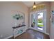 Welcoming foyer with tile flooring, high ceilings, and elegant decor with lots of light at 3606 Whippoorwill Blvd, Punta Gorda, FL 33950