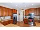 Spacious kitchen featuring stainless steel appliances, granite countertops, and tile flooring at 3606 Whippoorwill Blvd, Punta Gorda, FL 33950