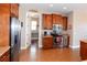 Well-lit kitchen with stainless steel appliances, wooden cabinets, and tile flooring at 3606 Whippoorwill Blvd, Punta Gorda, FL 33950