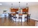 Kitchen with bar seating, pendant lighting, and granite countertops at 3606 Whippoorwill Blvd, Punta Gorda, FL 33950