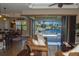 Living room featuring water views and access to the pool area at 3606 Whippoorwill Blvd, Punta Gorda, FL 33950