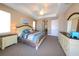 Main bedroom with tray ceilings, carpet flooring, and light walls at 3606 Whippoorwill Blvd, Punta Gorda, FL 33950