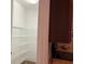 Walk-in pantry provides ample storage with adjustable shelving for organized kitchen essentials at 3606 Whippoorwill Blvd, Punta Gorda, FL 33950