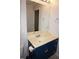 Bathroom featuring blue cabinets, neutral countertops, and an oval sink at 594 W Tarpon Nw Blvd, Port Charlotte, FL 33952