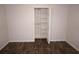Bright bedroom featuring wood-look floors and a closet at 594 W Tarpon Nw Blvd, Port Charlotte, FL 33952