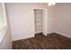 Bright bedroom featuring wood-look floors and a closet at 594 W Tarpon Nw Blvd, Port Charlotte, FL 33952
