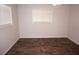 Bright bedroom featuring wood-look floors and a large window at 594 W Tarpon Nw Blvd, Port Charlotte, FL 33952