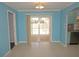 Bright dining area with sliding door access to the pool and modern tile flooring at 594 W Tarpon Nw Blvd, Port Charlotte, FL 33952