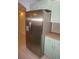 Close-up of stainless steel refrigerator and adjacent cabinets in the kitchen at 594 W Tarpon Nw Blvd, Port Charlotte, FL 33952
