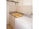 Laundry room featuring a utility sink and a modern washer and dryer at 594 W Tarpon Nw Blvd, Port Charlotte, FL 33952