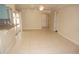 Open living area with tile flooring, sliding glass door, and view to other living spaces at 594 W Tarpon Nw Blvd, Port Charlotte, FL 33952