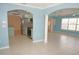 Open concept living area, showing tile floors, archways, kitchen, and plenty of light at 594 W Tarpon Nw Blvd, Port Charlotte, FL 33952