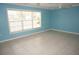 Inviting living room featuring a large window and tile flooring at 594 W Tarpon Nw Blvd, Port Charlotte, FL 33952