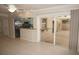 Open layout of the living room and kitchen, leading to the covered patio at 594 W Tarpon Nw Blvd, Port Charlotte, FL 33952