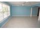 Open-concept living area with tile floors, natural light, and ceiling fans at 594 W Tarpon Nw Blvd, Port Charlotte, FL 33952