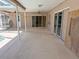 Covered patio with ceiling fans and access to the screened pool at 594 W Tarpon Nw Blvd, Port Charlotte, FL 33952