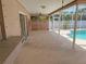 Covered patio leads to the screened pool with fenced backyard at 594 W Tarpon Nw Blvd, Port Charlotte, FL 33952