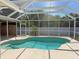 Beautiful screened pool with clear blue water and a bright pool deck at 594 W Tarpon Nw Blvd, Port Charlotte, FL 33952
