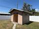 Storage shed in the backyard provides practical space for tools and outdoor equipment at 594 W Tarpon Nw Blvd, Port Charlotte, FL 33952
