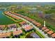 Aerial view of beautiful homes along a tranquil lake at 10357 Crooked Creek Dr, Venice, FL 34293