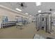 Well-equipped gym featuring weight machines, free weights, mirrors, and ample workout space at 10357 Crooked Creek Dr, Venice, FL 34293