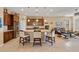 Modern kitchen featuring granite countertops, stainless steel appliances, a large island, and pendant lighting at 10357 Crooked Creek Dr, Venice, FL 34293