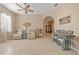 Bright living area with comfortable seating, neutral decor, and tile flooring at 10357 Crooked Creek Dr, Venice, FL 34293