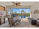 Inviting screened lanai with a summer kitchen, dining area and outdoor pool, perfect for entertaining at 10357 Crooked Creek Dr, Venice, FL 34293