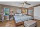 Spacious main bedroom with decorative wall and ceiling fan at 122 Colonial Se St, Port Charlotte, FL 33952