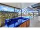 Outdoor patio with jacuzzi and pool in the background at 122 Colonial Se St, Port Charlotte, FL 33952