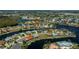 Aerial view of waterfront homes and waterways, with community landscaping at 1230 Royal Tern Dr, Punta Gorda, FL 33950