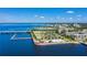 Scenic aerial shot showcases a pier, beach, and bridge along the blue waterfront at 1230 Royal Tern Dr, Punta Gorda, FL 33950