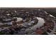 Aerial view of a waterfront community highlighting homes with boat docks along winding canals at sunset at 1230 Royal Tern Dr, Punta Gorda, FL 33950