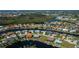Wide aerial view of waterfront homes along canals and lakes with mature trees and landscaping at 1230 Royal Tern Dr, Punta Gorda, FL 33950