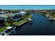 Aerial view of backyard, canal and waterfront homes at 1230 Royal Tern Dr, Punta Gorda, FL 33950