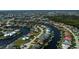 Expansive aerial shot showcasing luxury homes lining winding canals, creating a picturesque waterfront community at 1230 Royal Tern Dr, Punta Gorda, FL 33950